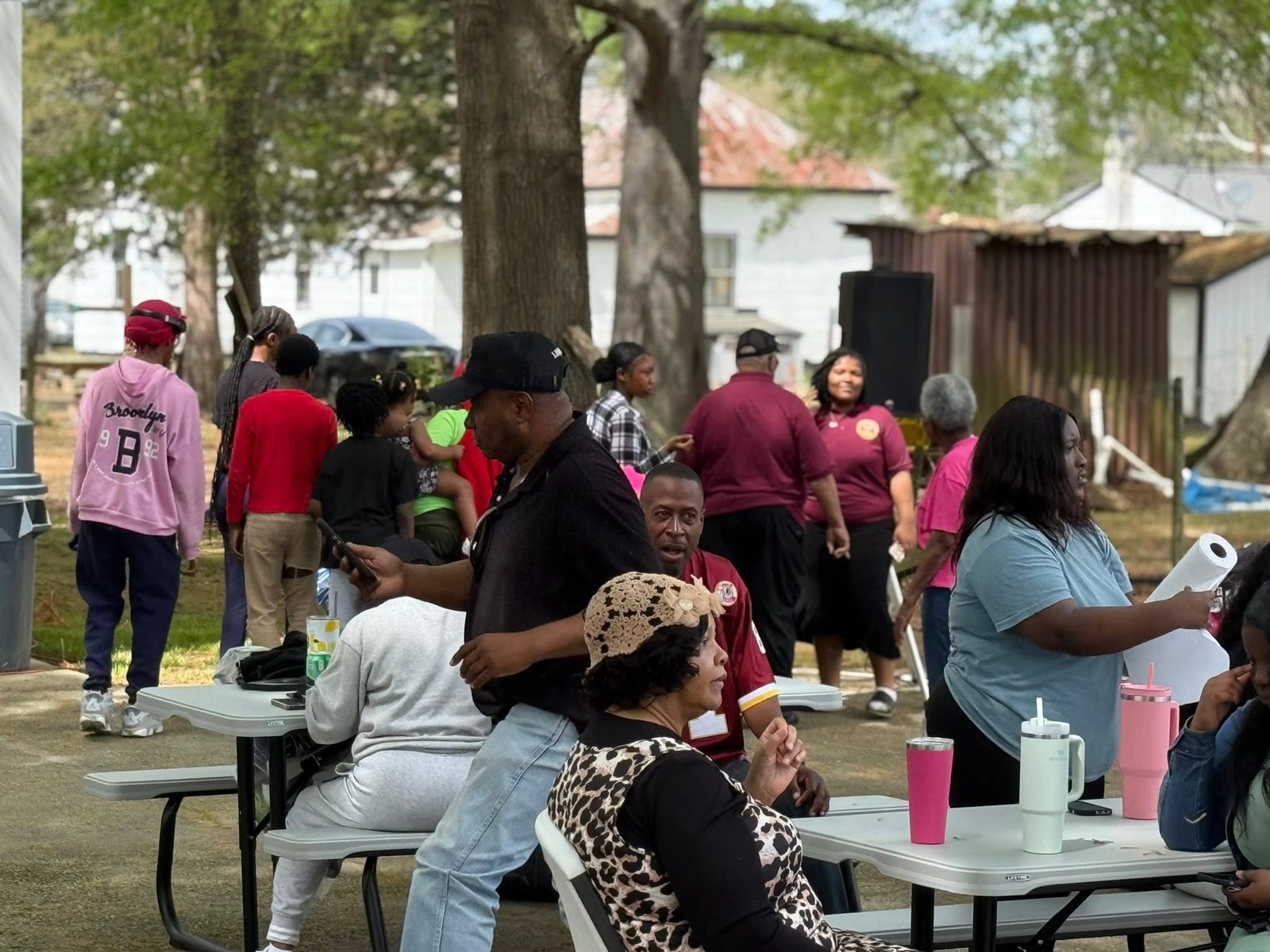 Neighbors and volunteers connecting during an outdoor event